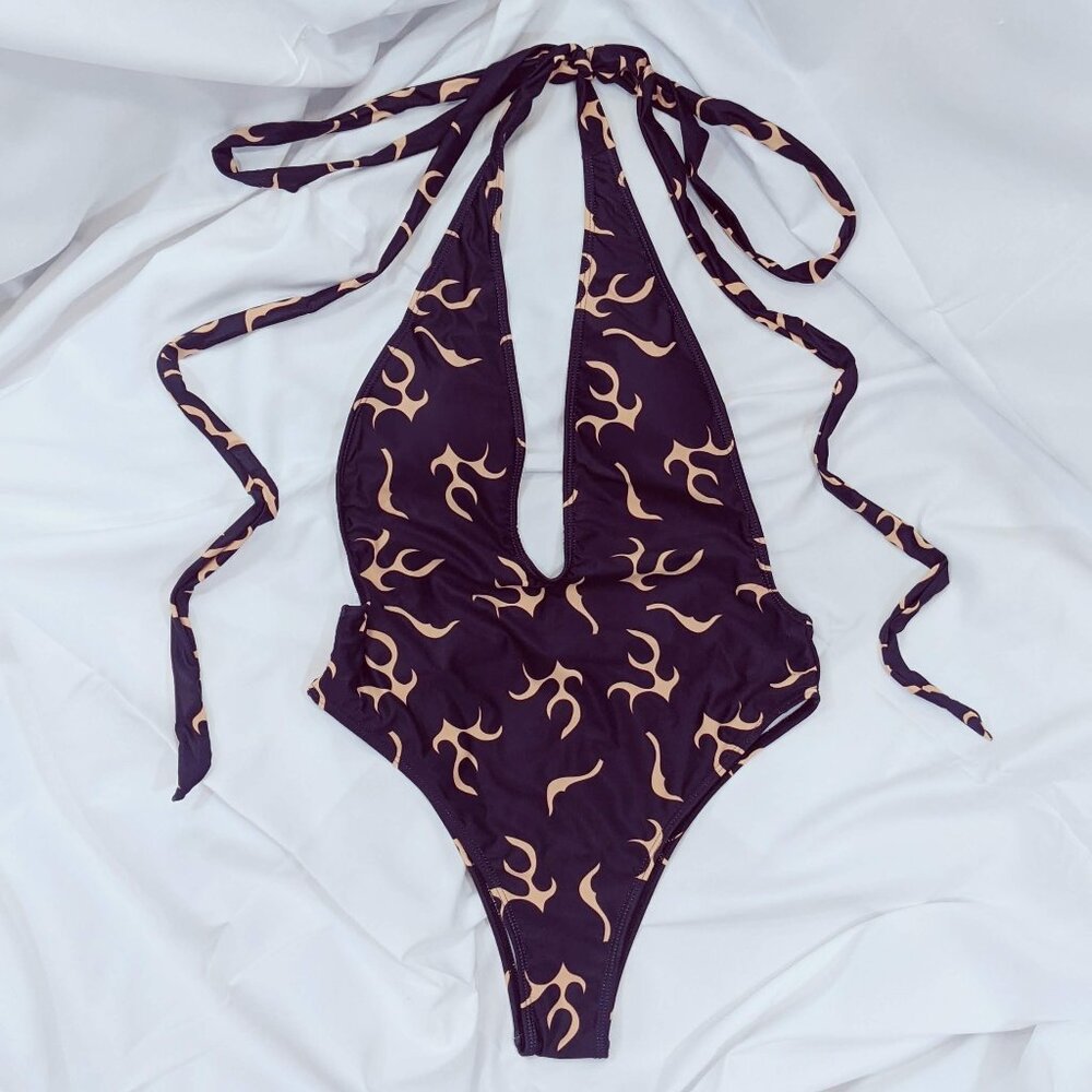 Black one-piece swimsuit with graphic flame print